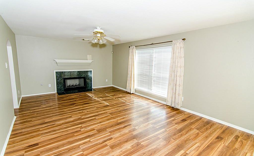 Remodeled Interior Including Wood Flooring and Paint Job in Richmond, TX Living Room